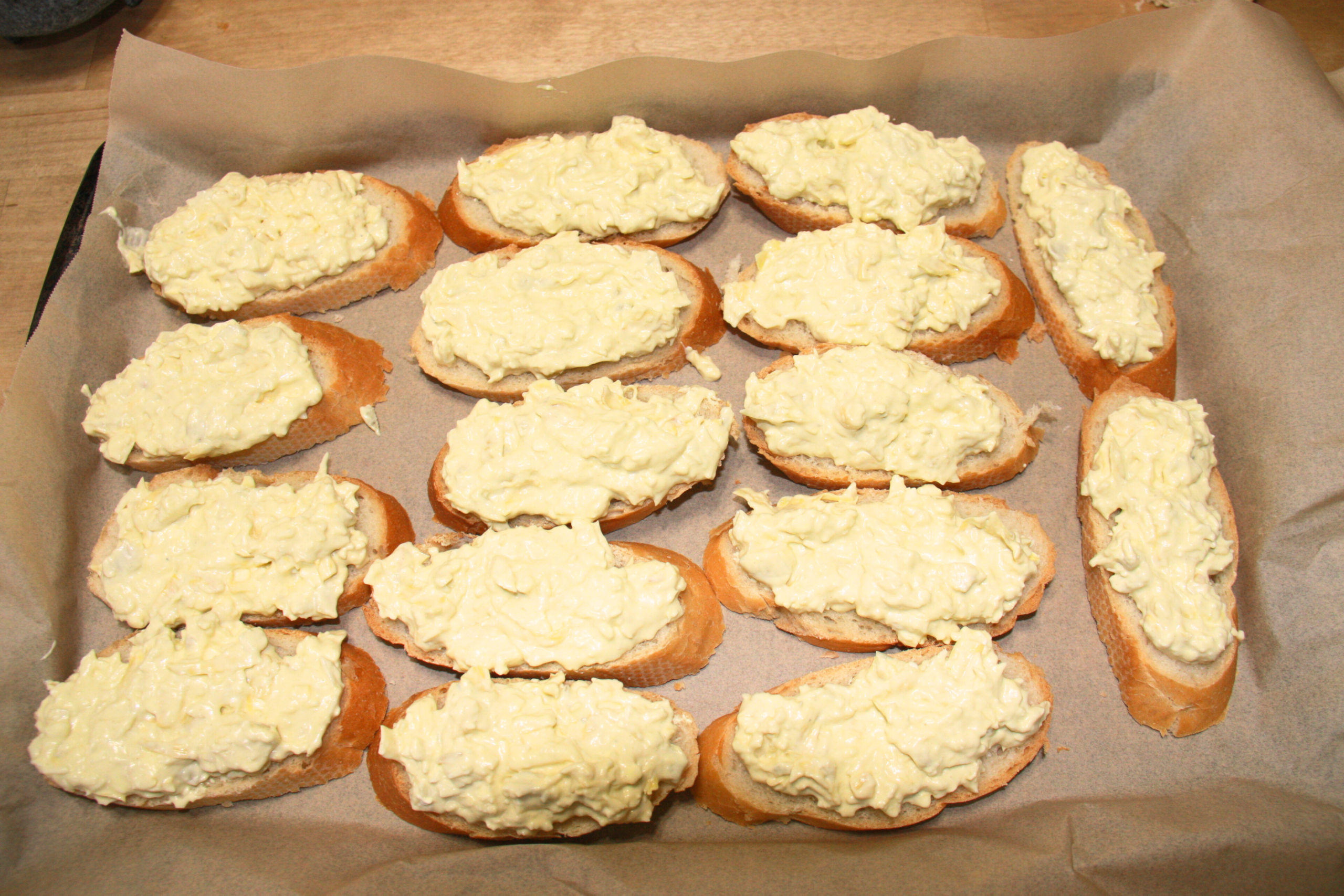 Artichoke Bruschetta on a tray before being baked.